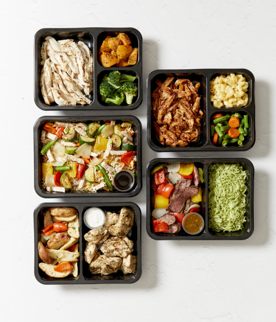 Top-down view of several healthy prepared meals from Fitlife Foods