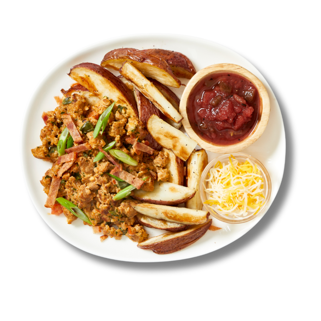 Chicken Protein Potato Skins; a new menu item from Fitlife Foods featuring loaded potato skins, ground chicken, cheese, chicken bacon, cheese sauce and salsa