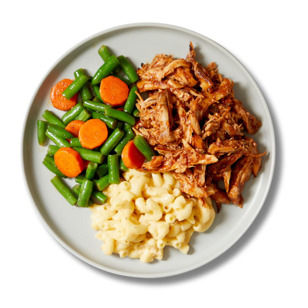 Memphis Pulled Chicken, a dish with pulled chicken tossed in house-made BBQ sauce with sides of butternut mac 'n' cheese and BBQ butter vegetables, available through Fitlife Foods new summer menu
