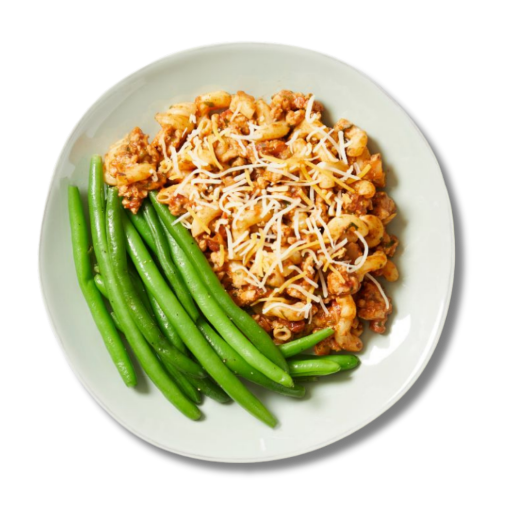 Chilli Mac, lean ground turkey in tomato sauce tossed with elbow pasta and cheese, with green beans on the side; from Fitlife Foods new summer menu