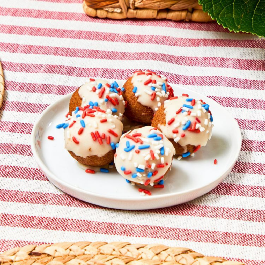 Patriotic Pops, cake-style donut holes with vanilla frosting and red, white and blue sprinkles, from Fitlife Foods new summer menu