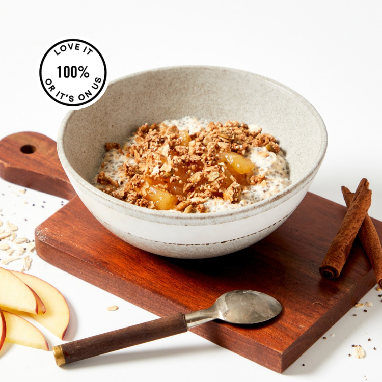 A bowl showing Rolled oats, chia seeds, cinnamon apples, and crunchy granola come together for a delicious, fiber-rich start to your day.