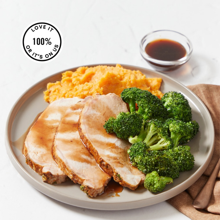 A plate showing Tender pork tenderloin finished with a rich honey-balsamic glaze, paired with creamy Parmesan mashed sweet potatoes and oven-roasted broccoli.